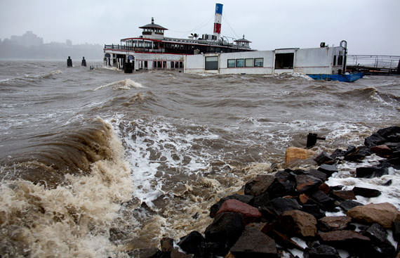 A historic ferry boat named the Binghamton, swamped by the waves on the Hudson River in Edgewater, New Jersey, on October 29, 2012 as Hurricane Sandy lashed the East Coast. (AP Photo/Craig Ruttle)
